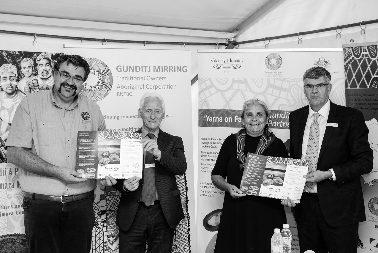 Signing of the Gunditj Mirring and Glenelg Hopkins CMA Partnership Statement at Budj Bim National Park 2015 - Damein Bell (Gunditj Mirring), Kevin Wood (GHCMA), Denise Lovett (Gunditj Mirring) and Tony Ford (GHCMA)